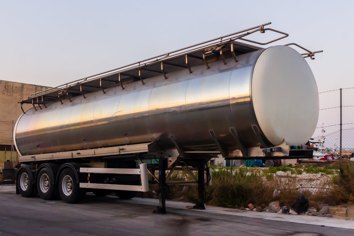 A stainless-steel fuel tanker trailer ready for service