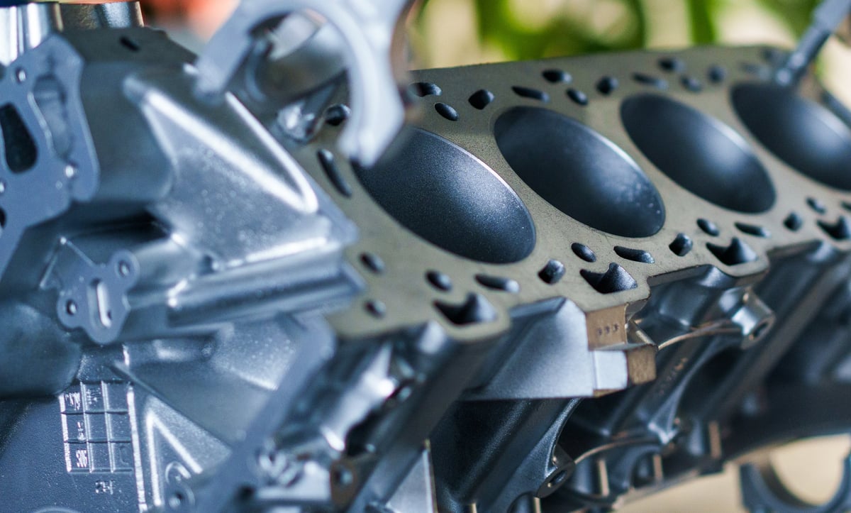 Close-up of a heavy-duty engine head and components being serviced
