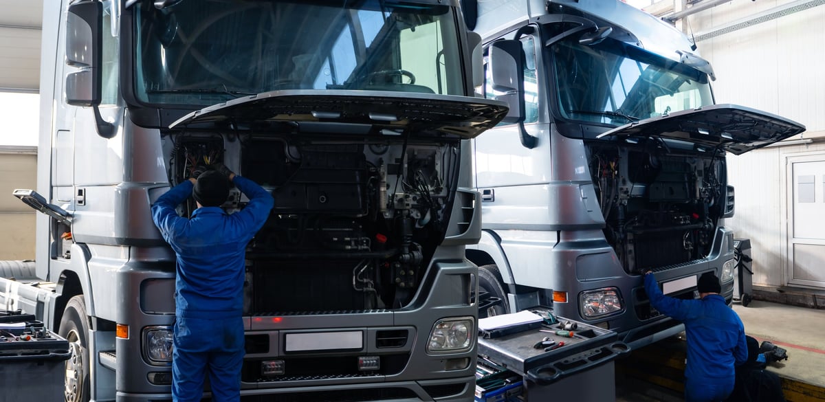 A commercial truck service workshop with heavy-duty equipment
