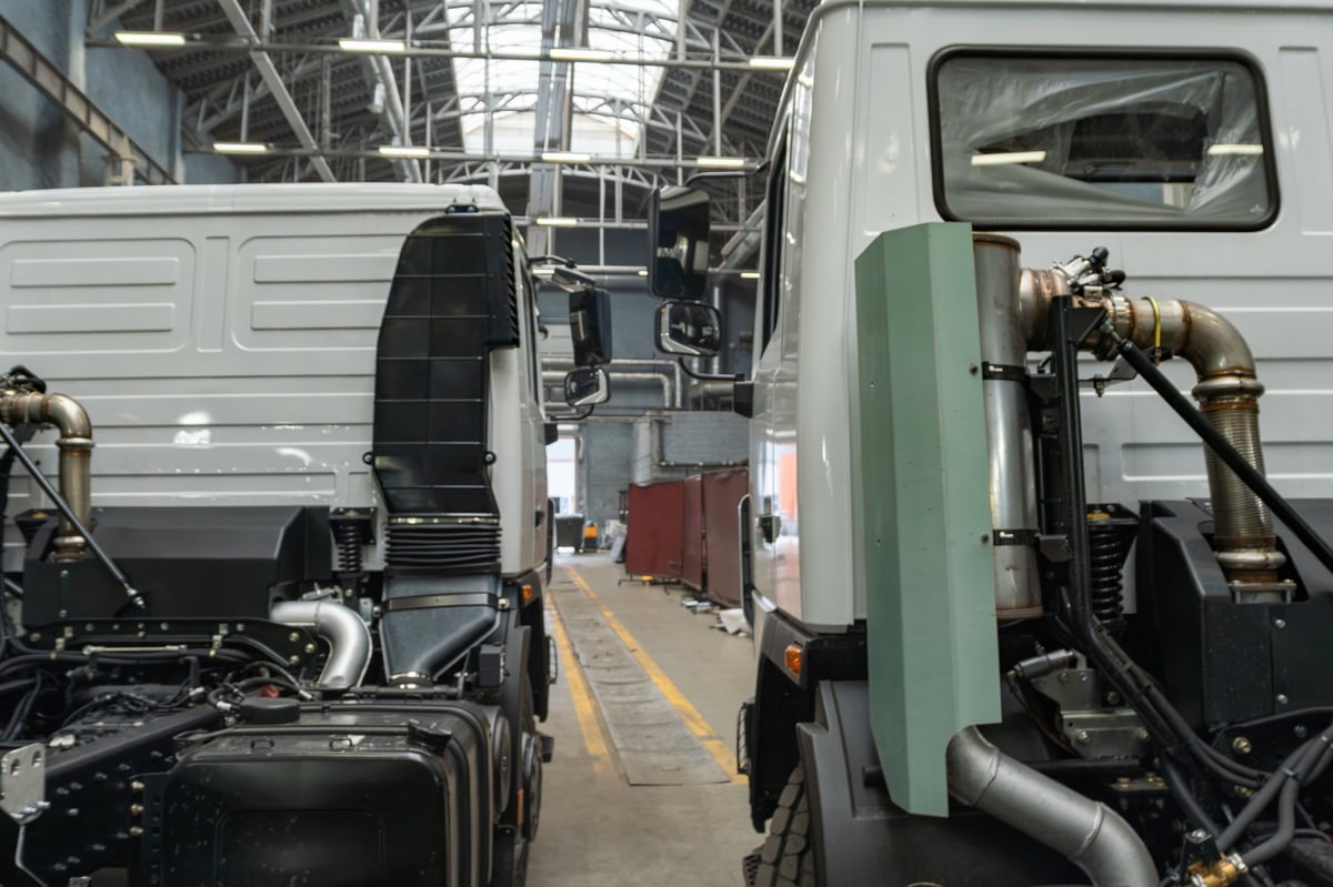 Commercial semi trucks in a heavy transport industrial facility